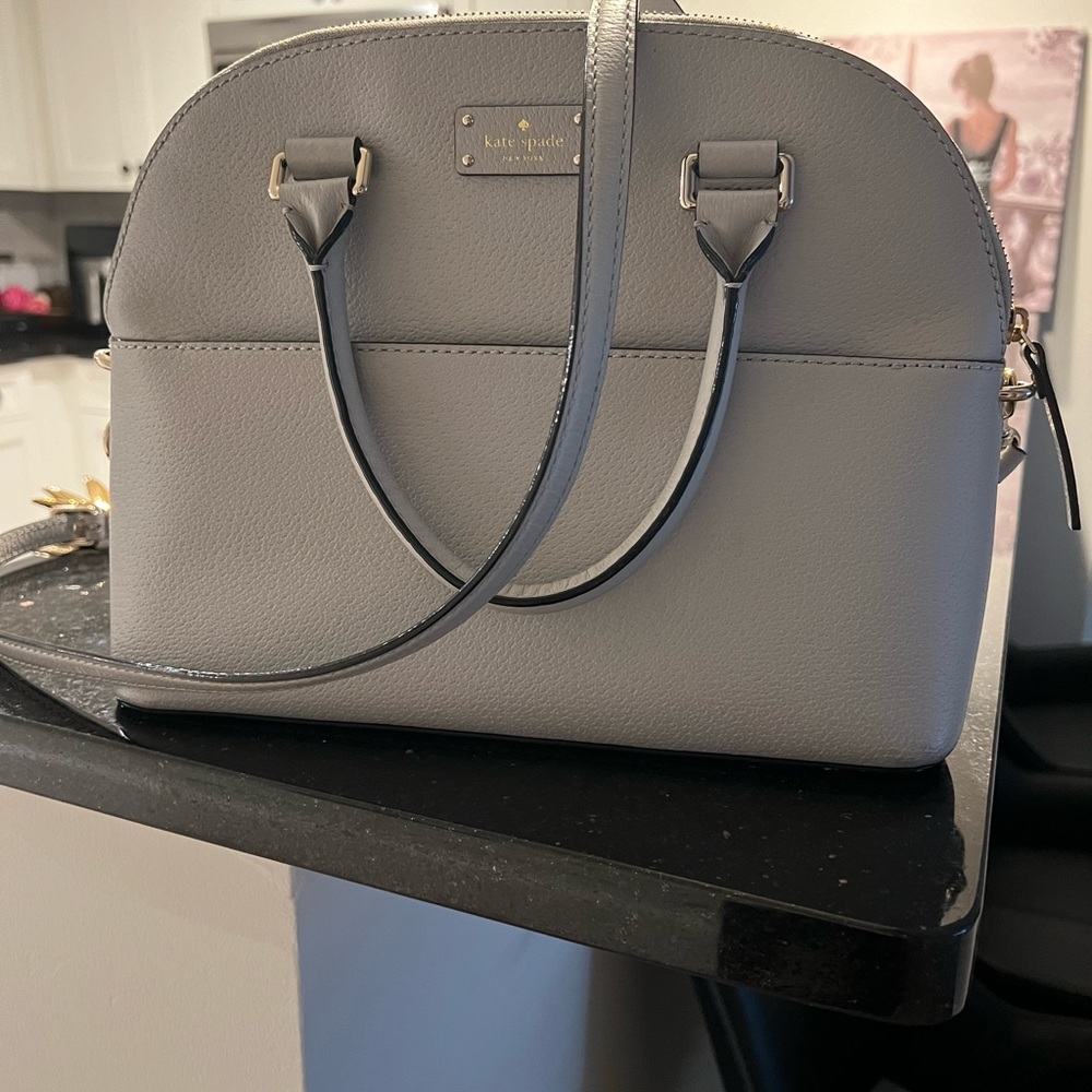 Kate Spade satchel with crossbody strap. Color: Blue dawn.